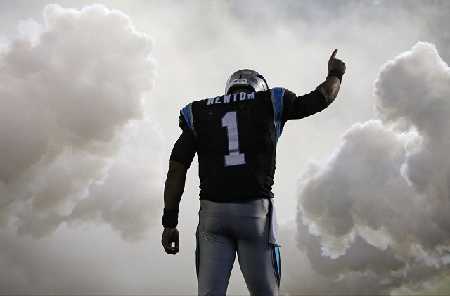 Carolina Panthers' Cam Newton (1) is introduced before an NFL football game against the Indianapolis Colts in Charlotte, N.C., Monday, Nov. 2, 2015. (AP Photo/Chuck Burton)