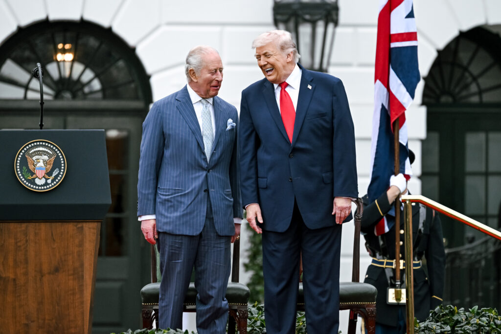 King Charles III and King Donald J. Trump laugh in front of the White House.